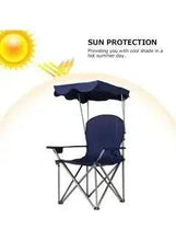Folding beach chair with navy seat, dark canopy cover, and metal folding frame