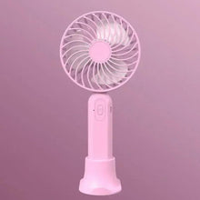 Pink portable handheld fan with control button and charging base