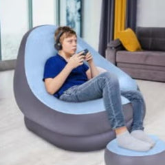 Huitich portable inflatable chair for home in gray and blue with a boy gaming and wearing headphones