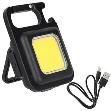 Black mini pocket LED light with hinged stand and carry strap, bright square glow