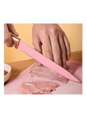 Huitich 19-piece premium cooking set UAE with pink knife cutting raw meat on a chopping board