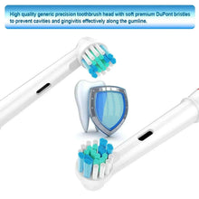 Replacement toothbrush head with blue bristles on white handle, close-up view