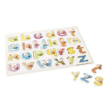 Alphabet peg puzzle board with matching letter pieces partly removed
