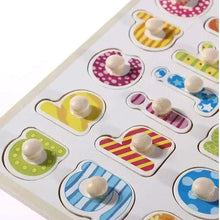 Close-up of alphabet puzzle pegs in colorful letter-shaped slots