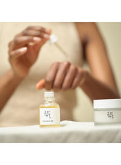 Beauty of Joseon Propolis Niacinamide Glow Serum in a dropper bottle held by a person for skincare routine