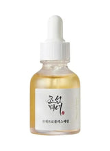 Glass dropper bottle with golden serum, white cap and label