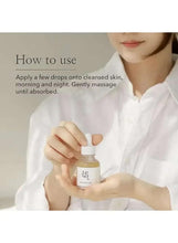 Facial serum bottle with dropper held by person; on-screen use instructions