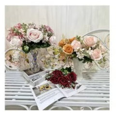 Huitich artificial flowers arranged in vases with purple flower home decor on a white table