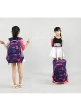 Purple and pink rolling school trolley bag with wheels, worn by child
