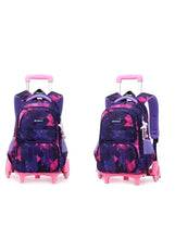 Purple and pink geometric rolling school trolley bag with pink top handle and side straps