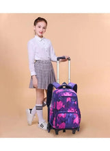 Purple and pink rolling school trolley bag with telescoping handle and front pocket