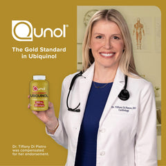 Female cardiologist holding bottle of Qunol Ubiquinol CoQ10 200mg softgels against gold backdrop