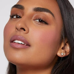 Close-up of a woman wearing Rare Beauty Soft Pinch Liquid Blush with smooth natural makeup look