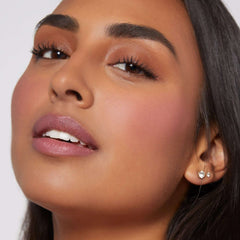 Close-up of a woman wearing Rare Beauty Soft Pinch Liquid Blush with natural makeup look