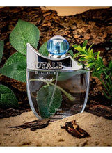 Royale Blue men’s eau de parfum bottle on stone with green leaves