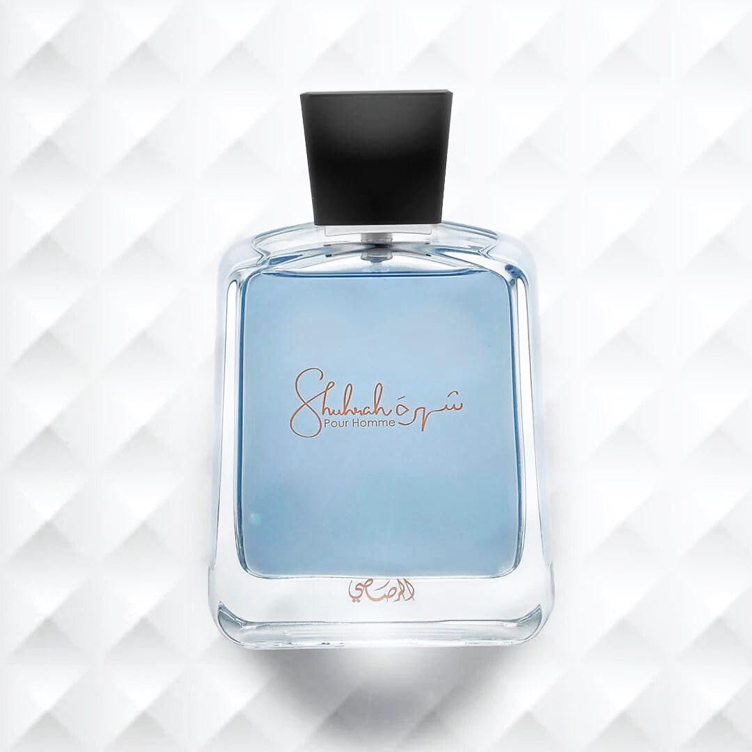 Rasasi Shuhrah for Men perfume bottle with blue liquid and black cap by RASASI