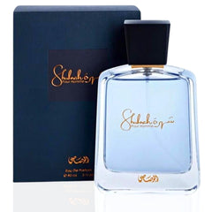 Rasasi Shuhrah for Men perfume bottle with black cap and dark blue packaging box
