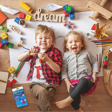 Kids omega-3 fish oil supplement box on tabletop near smiling children