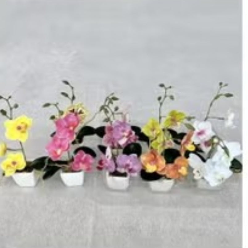 Huitich artificial flowers featuring realistic faux orchids for home decor in various colors with green leaves in white pots