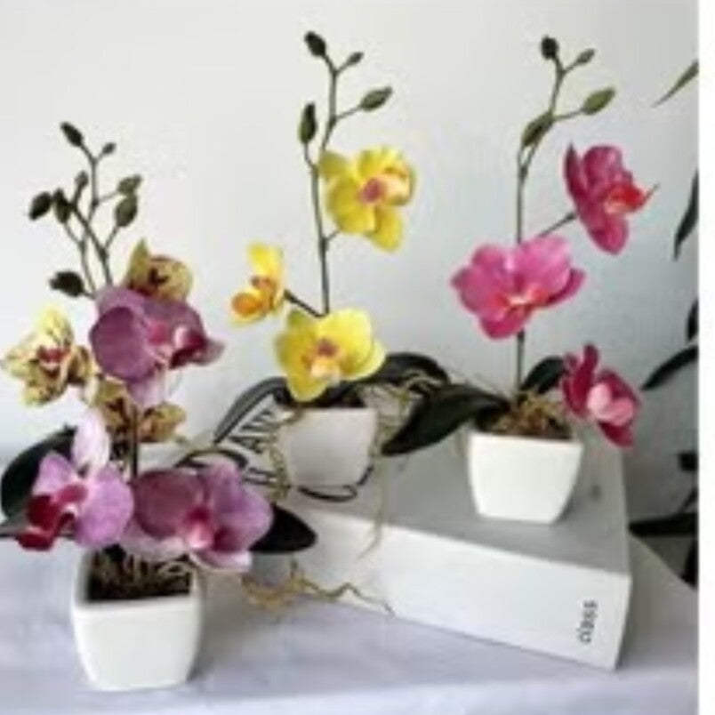 Huitich realistic faux orchids for home decor in pink yellow and purple colors with white square pots