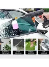 Rechargeable power washer gun spraying water at car window; pink soap bottle