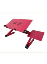 Pink folding laptop desk with airflow vent holes and black height-adjustable legs