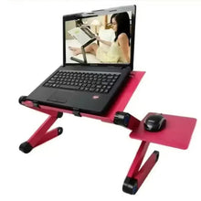 Folding laptop table with pink surface and black support legs, set for use