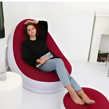 Red inflatable lounge chair with footrest, reclining seat with side profile