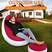 Red inflatable lounge chair with footrest, rounded back and contoured seat