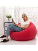 Red inflatable bean bag lounge chair with smooth fabric and wide base