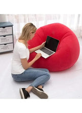 Red inflatable bean bag chair, rounded seat and back for lounging