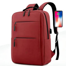 Red waterproof travel backpack with front zipper pockets and top carry handle