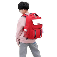 Red school trolley backpack with front pocket, side straps, wheels, and pull handle