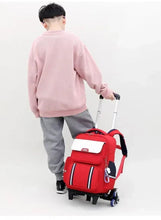 Red trolley school bag with backpack straps and telescoping handle
