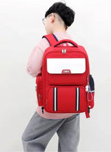Red six-wheel trolley school bag with arched handle and front zipper pocket