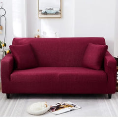 Huitich red two seater sofa cover fitted on a modern sofa with matching cushions in a bright living room