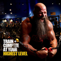 Muscular athlete doing cable chest workout in gym promoting Redcon1 Total War pre workout UAE for intense training
