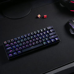 Redragon compact mechanical keyboard for Windows Mac Android with RGB backlit keys on black desk