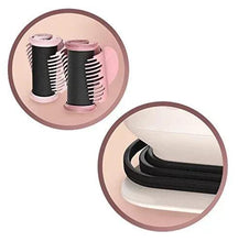 Heatable hair rollers with black roller barrels and pink bases, close-up
