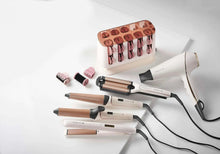 Heatable hair rollers set with multiple curlers and cords, plus storage base
