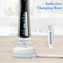 Inductive toothbrush charging base with white stand and blue toothbrush handle