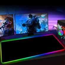 RGB gaming mouse pad on desk with glowing rainbow edge and dark center