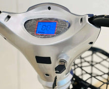Electric scooter instrument panel with blue digital display, white housing, key area