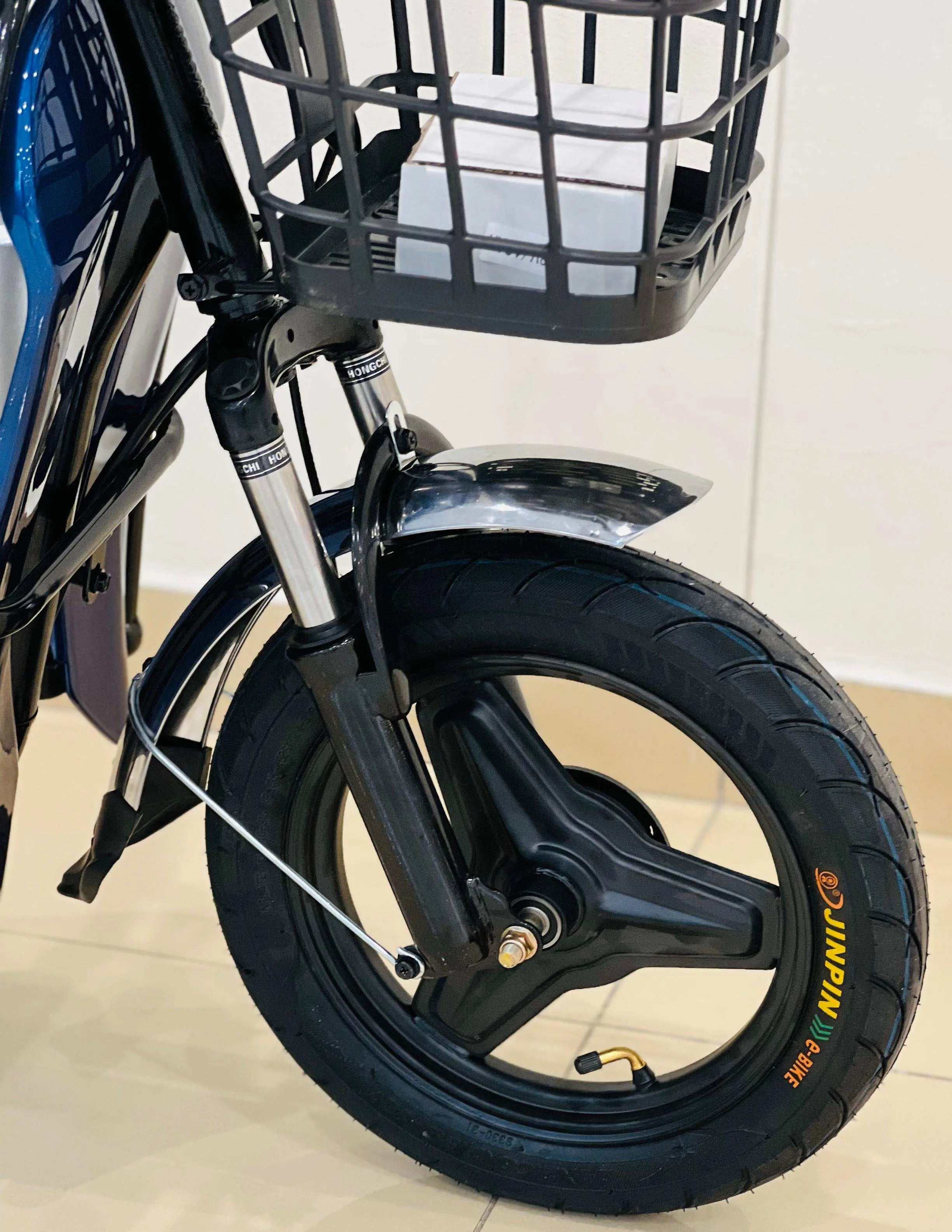 Close-up of RohaN Wings electric scooter UAE showcasing durable tire and front suspension system