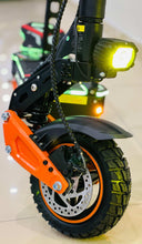 Electric bike front wheel with brake rotor and bright yellow headlight
