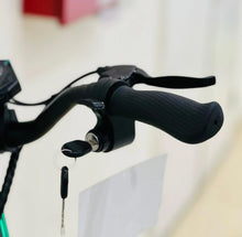 Electric bike handlebar with black grips and control module