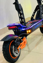 Electric bike rear section with neon tail lights and orange rim accents