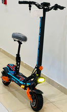 Electric scooter-style electric bike with blue frame stripes, orange accents and glowing headlight