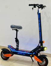 Electric scooter-style electric bike with black frame, blue stripe, orange wheels and headlight