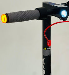 Close-up of RohaN Wings HT04 electric scooter UAE handlebar with LED lights and textured grip